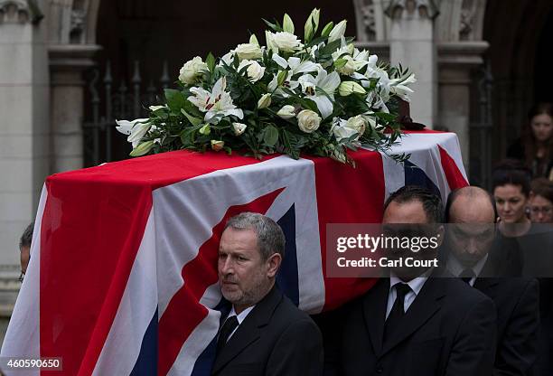 The coffin is carried out during the funeral of former Liberal Party party leader Jeremy Thorpe at Saint Margaret's Church on December 16, 2014 in...