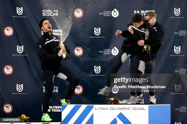 Eduardo Alvarez, J.R. Celski and Jordan Malone celebrate on the medals podium after the men's 500 meter during the U.S. Olympic Short Track Trials at...