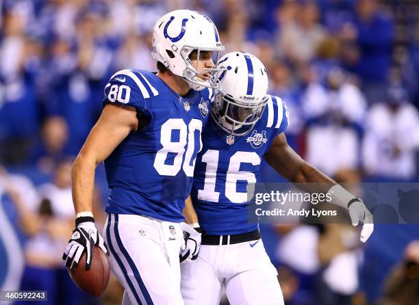 Tight end Coby Fleener celebrates a touchdown with wide receiver Da'Rick Rogers of the Indianapolis Colts against the Kansas City Chiefs during a...