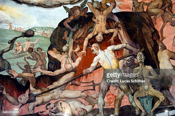 Detail of The Last Judgement part of Vasari's frescoes adorning the Brunelleschi's dome of Florence Cathedral or Basilica of Saint Mary of the Flower...