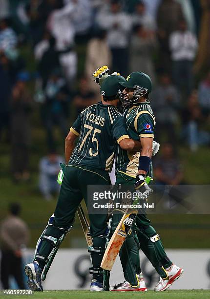 Younis Khan is congratulated by Shahid Afridi after reaching his century during the 4th One Day International match between Pakistan and New Zealand...