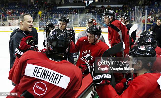 Assistant Coach Dave Lowry talks to the forwards during the Canada National Junior Team practice at the Meridian Centre on December 17, 2014 in St...