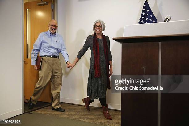 Alan Gross, with his wife Judy, arrive before making a statement to the news media at the law offices of Gilbert LLC after arriving back in the...