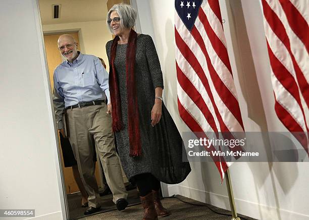 Alan Gross , recently released by Cuban authorities, and his wife Judy arrive for brief remarks during a press conference at his lawyer's office...