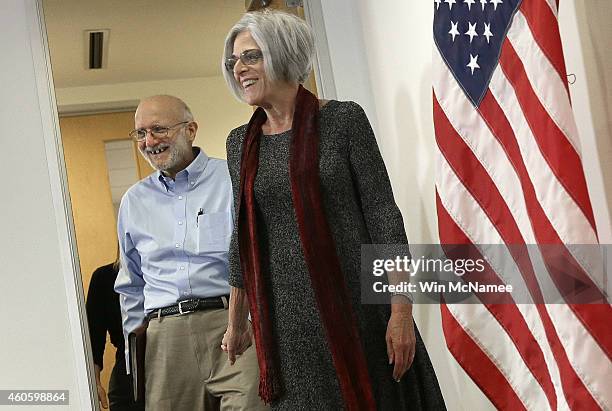 Alan Gross , recently released by Cuban authorities, and his wife Judy arrive for brief remarks during a press conference at his lawyer's office...