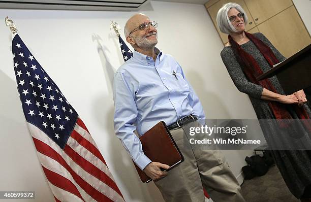 Alan Gross, recently released by Cuban authorities, departs after concluding his remarks with his wife Judy at a press conference at his lawyer's...