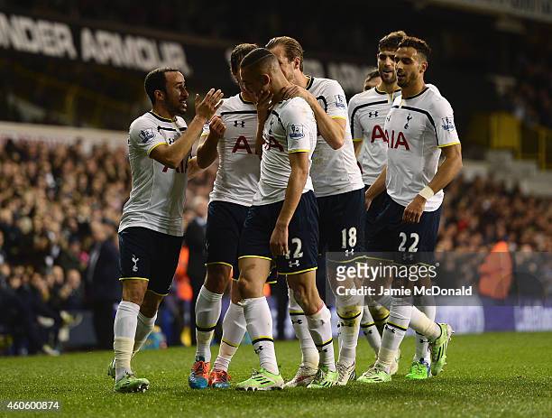 Nabil Bentaleb of Tottenham Hotspur celebrates scoring the opening goal with team mates during the Capital One Cup Quarter-Final match between...