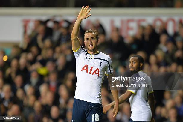 Tottenham Hotspur's English striker Harry Kane celebrates scoring their third goal during the English League Cup quarter-final football match between...