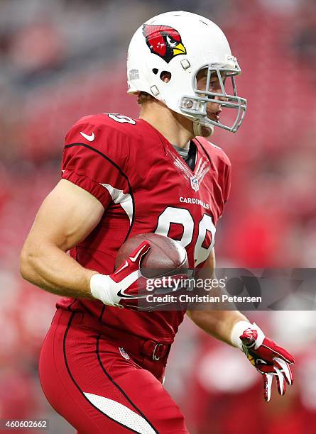 Tight end John Carlson of the Arizona Cardinals warms up before the NFL game against the Kansas City Chiefs at the University of Phoenix Stadium on...