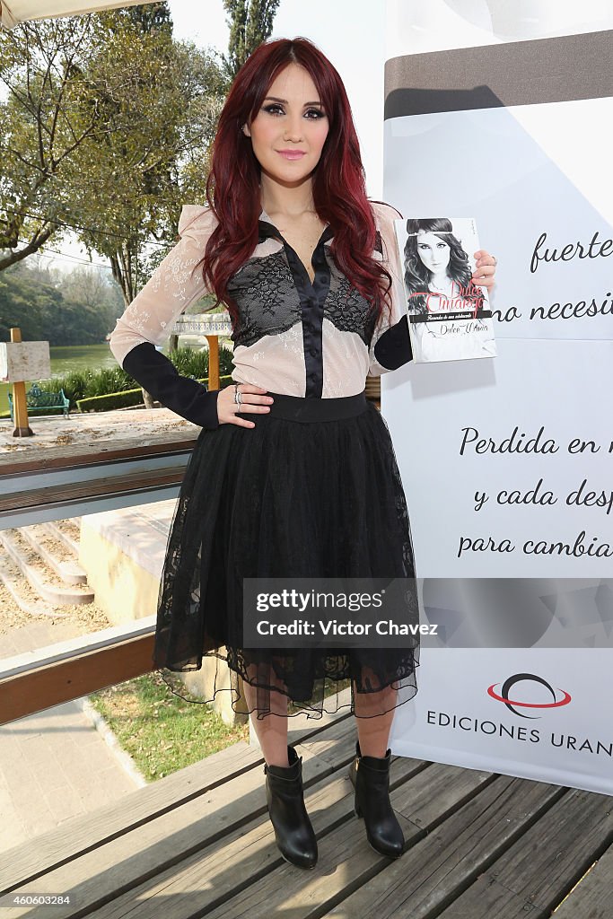 Dulce Maria Signs Copies Of Her Book "Dulce Amargo Recuerdos De Una Adolecente"