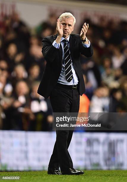 Alan Pardew, manager of Newcastle United applauds the fans after the Capital One Cup Quarter-Final match between Tottenham Hotspur and Newcastle...