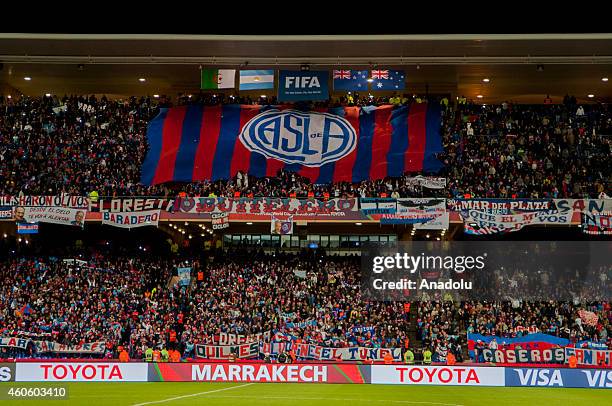 San Lorenzo fans cheer their team during the 2014 FIFA Club World Cup semi final soccer match between San Lorenzo and Auckland City FC at the...