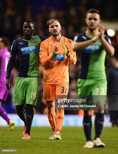Goalkeeper Jak Alnwick of Newcastle United is consoled by Massadio Haidara of Newcastle United after the Capital One Cup Quarter-Final match between...
