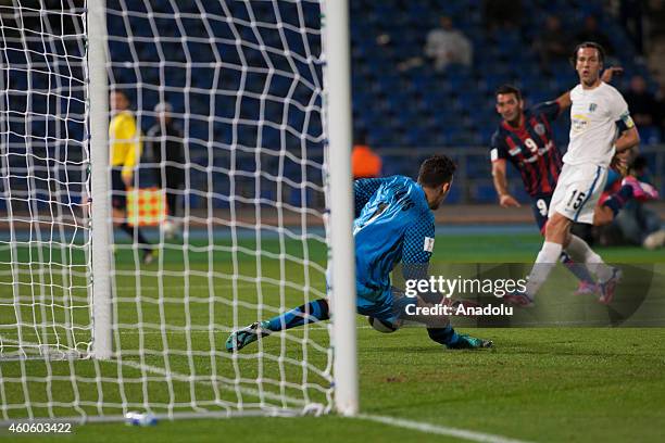 Martin Cauteruccio of San Lorenzo in action against Tamati Williams of Auckland City during the 2014 FIFA Club World Cup semi final soccer match...