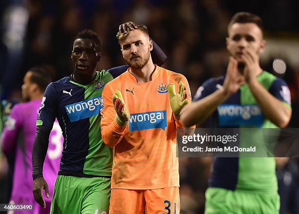 Goalkeeper Jak Alnwick of Newcastle United is consoled by Massadio Haidara of Newcastle United after the Capital One Cup Quarter-Final match between...