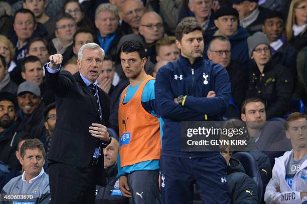 Newcastle United's English manager Alan Pardew gestures on the touchline next to Tottenham Hotspur's Argentinian Head Coach Mauricio Pochettino...