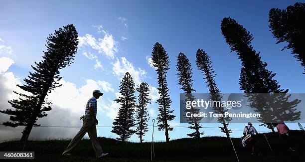 Zach Johnson and Jason Dufner walk to the tee box during round two of the Hyundai Tournament of Champions at the Plantation Course at Kapalua Golf...
