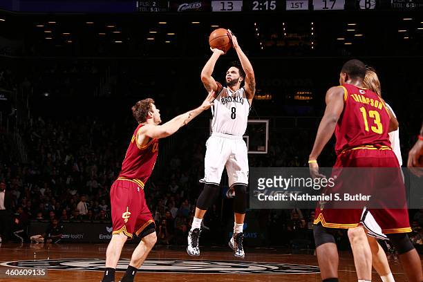 Deron Williams of the Brooklyn Nets shoots against Matthew Dellavedova of the Cleveland Cavaliers during a game at the Barclays Center on January 4,...