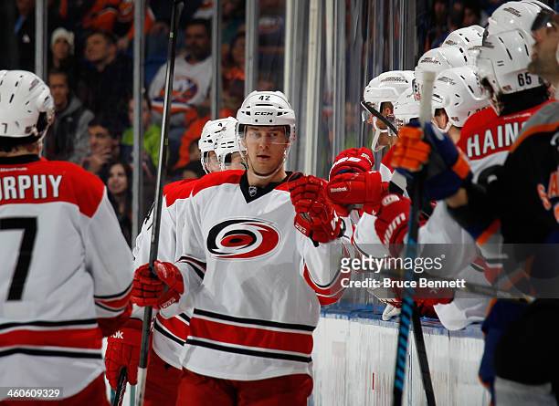 Brett Sutter of the Carolina Hurricanes celebrates his goal at 14:09 of the second period against the New York Islanders at the Nassau Veterans...