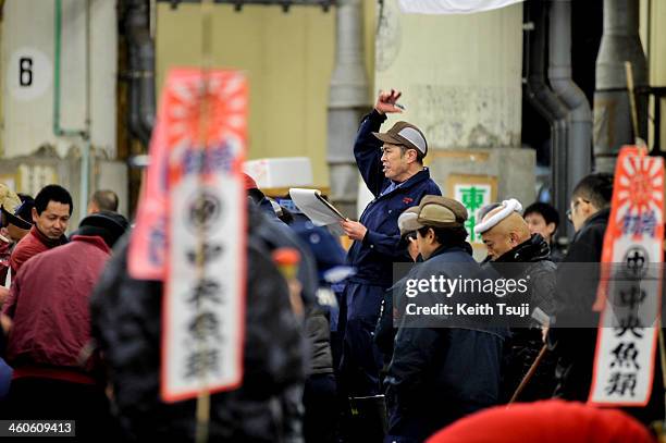 Auctioneer interacts with bidders on the year's first auction at Tsukiji Fish Market on January 5, 2014 in Tokyo, Japan. Tsukiji Fish Market is best...