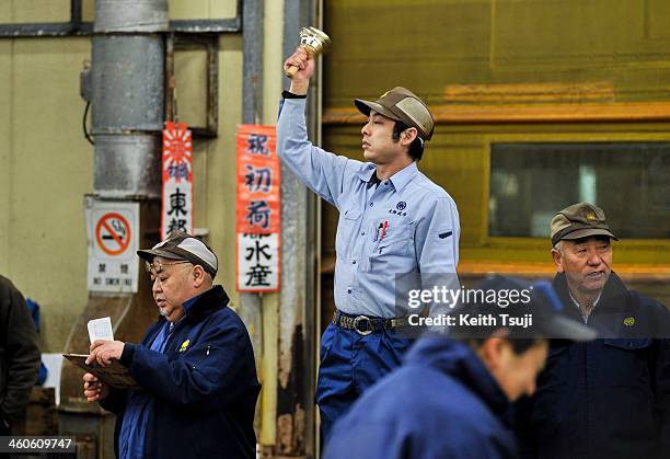 The auctioneer rings the bell to start off the year's first tuna auction at Tsukiji Fish Market on January 5, 2014 in Tokyo, Japan. Tsukiji Fish...