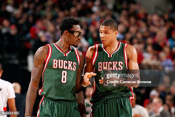 Larry Sanders and Giannis Antetokounmpo of the Milwaukee Bucks speak during a game against the Portland Trail Blazers on December 17, 2014 at the...