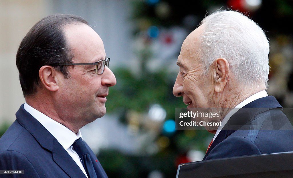 French President Francois Hollande Receives Shimon Peres At Elysee Palace In parsi