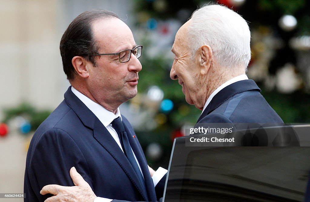 French President Francois Hollande Receives Shimon Peres At Elysee Palace In parsi