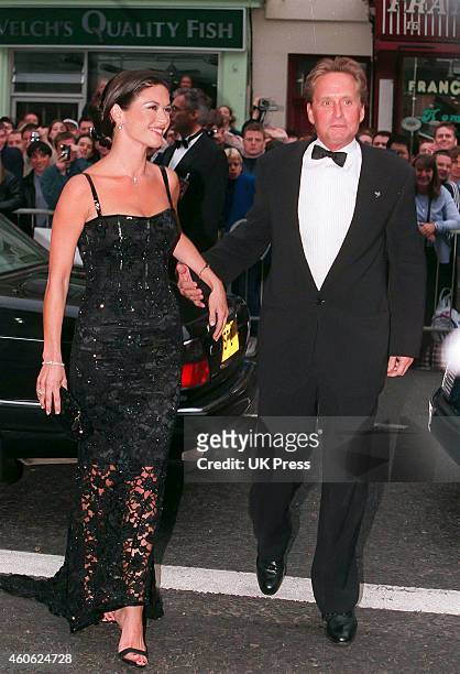 Catherine Zeta Jones, and Michael Douglas attend The Premiere of, Entrapment, in Edinburgh,, on June 30, 1999 in, Edinburgh, Scotland.