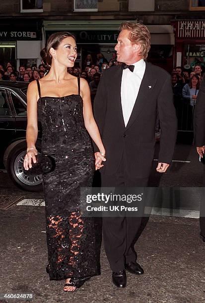 Catherine Zeta Jones, and Michael Douglas attend The Premiere of, Entrapment, in Edinburgh,, on June 30, 1999 in, Edinburgh, Scotland.