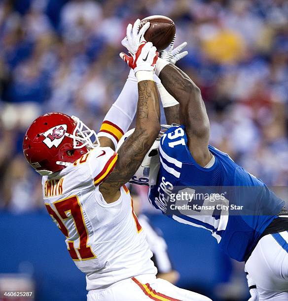 Indianapolis Colts wide receiver Da'Rick Rogers hauls in a 46-yard pass reception in front of Kansas City Chiefs cornerback Sean Smith in the third...
