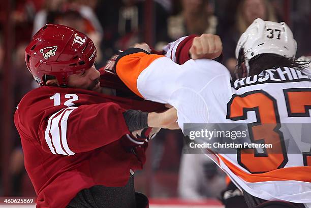 Paul Bissonnette of the Phoenix Coyotes fights with Jay Rosehill of the Philadelphia Flyers during the second period of the NHL game at Jobing.com...