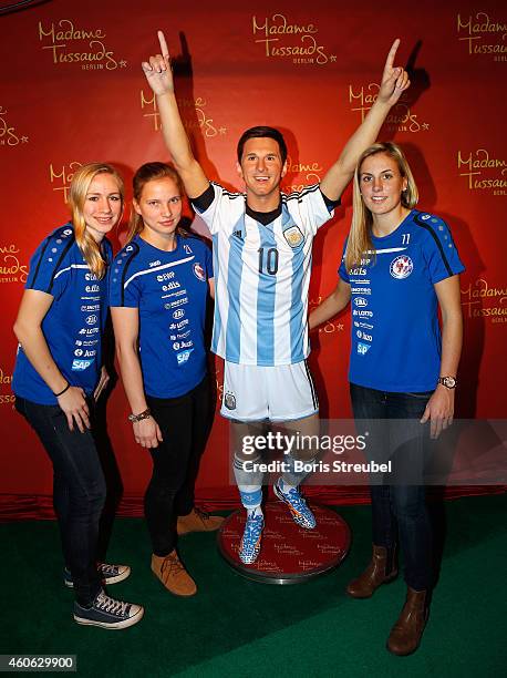 Pauline Bremer, Tabea Kemme and Jennifer Cramer of the women's national football team of Germany unveil a wax figure of the multiple world player of...