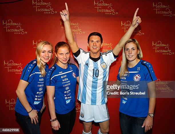Pauline Bremer, Tabea Kemme and Jennifer Cramer of the women's national football team of Germany unveil a wax figure of the multiple world player of...