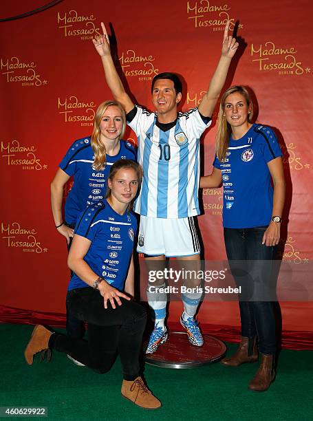 Pauline Bremer, Tabea Kemme and Jennifer Cramer of the women's national football team of Germany unveil a wax figure of the multiple world player of...