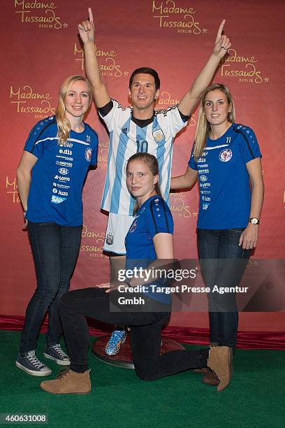 Football players of the national team of Germany Pauline Bremer, Tabea Kemme and Jennifer Cramer unveil a new wax figure of football player Lionel...