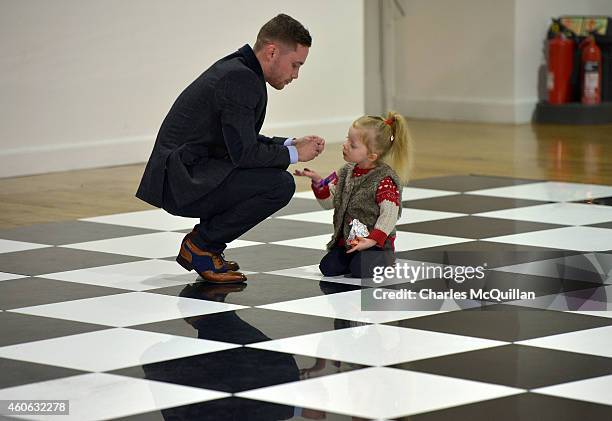 Carl Frampton's daughter Carla asks for a sweet before the press conference to announce the IBF World Super Bantamweight Championship fight between...