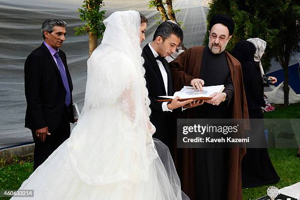 Parmis Taheri and Mostafa Aghaei seen with ex president Khatami after their wedding sermons at the social club of Mining & Industry Bank on May 1,...
