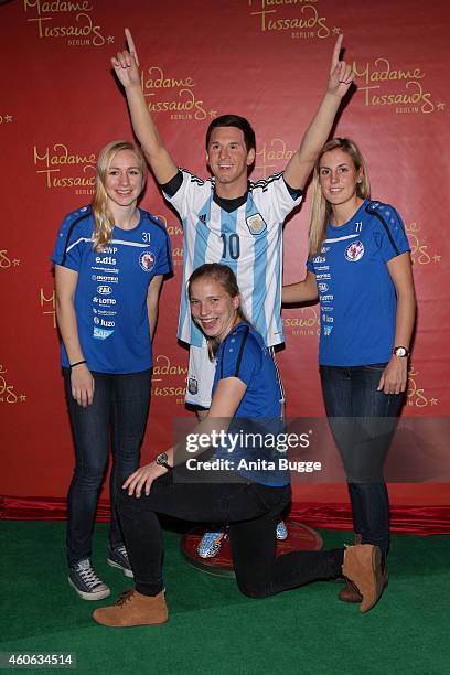 Pauline Bremer, Tabea Kemme and Jennifer Cramer of the women's national football team of Germany unveil a wax figure of the multiple world player of...
