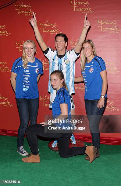 Pauline Bremer, Tabea Kemme and Jennifer Cramer of the women's national football team of Germany unveil a wax figure of the multiple world player of...