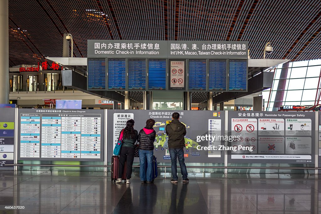 Passengers are reading flight message in Terminal 3 of...