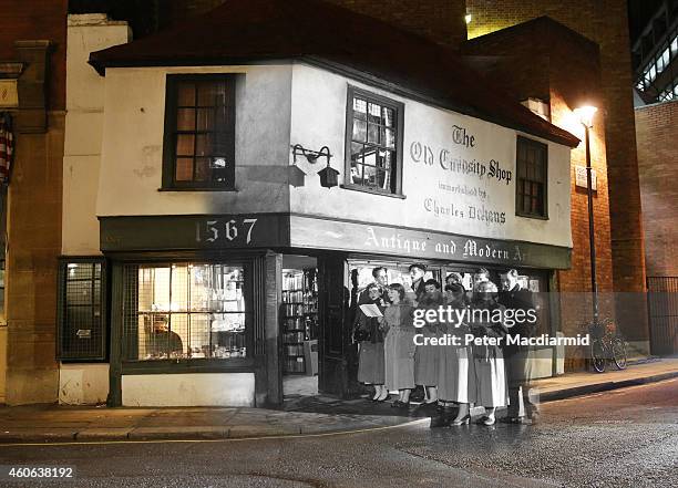 In this digital composite image a comparison has been made of London at Old Curiosity Shop in 1956 and Modern Day 2014 at Christmas time. LONDON,...