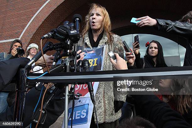 Elena Teyer at the podium addressing the media. She says she is a relative of Ibrahim Todashev: a friend of Dzhokhars brother who was killed by an...