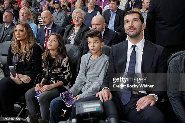 Former Sacramento Kings Peja Stojakovic sits with his wife Aleka Kamila and their kids as his jersey is retired during halftime against the Oklahoma...