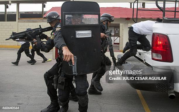 Cadets of the State Civil Police Force take part in a demonstration of Israeli training tactics in Monterrey, Nuevo Leon state, Mexico on December...