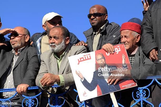 Tunisian presidential candidate Moncef Marzouki gives a speech as he meets with people as a part of his election campaign for the presidential...