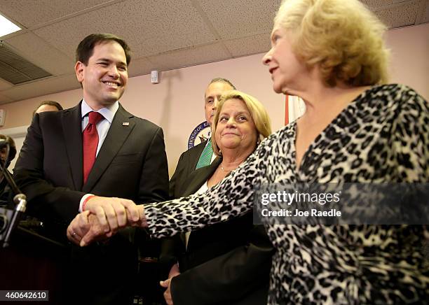 Sen. Marco Rubio greets Mirta Costa the mother of Carlos Costa, a pilot from a group called "Brothers to the Rescue" who was shot down by Cuban...