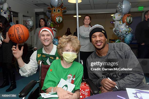 Boston Celtics Lucky The Mascot and Avery Bradley spend time with Jack at Boston Children's Hospital December 18, 2014 in Boston, Massachusetts.