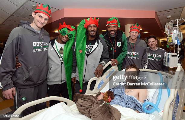 Boston Celtics Tyler Zeller, Marcus Smart, Gerald Wallace, Walter McCarty, Jay Larranaga and Darren Erman spend time with Nicholas at Boston...