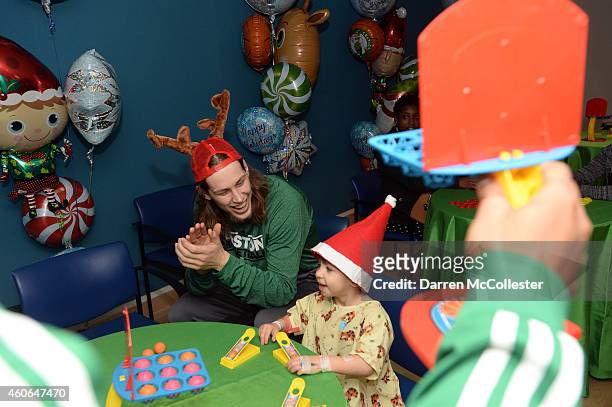 Boston Celtics Kelly Olynyk spends time Gabriel at Boston Children's Hospital December 18, 2014 in Boston, Massachusetts.